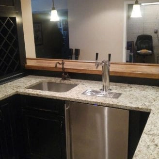 basement-bar-installation-with-granite-and-beer-cooler