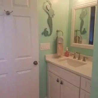 Bath Remodel with white cabinets and top in Dundalk MD
